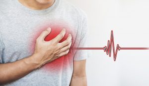 man clutching chest heart attack