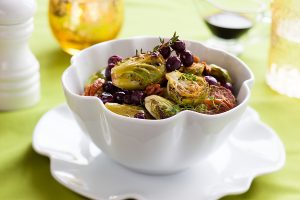 roasted brussels sprouts and squash in white bowl