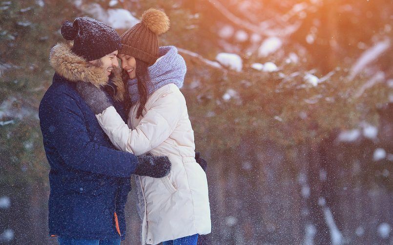 couple hugging in winter snow
